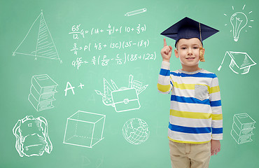 Image showing boy in bachelor hat and eyeglasses over blackboard