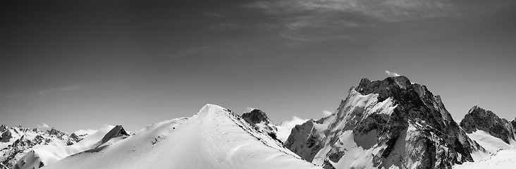 Image showing Black and white panorama of snowy mountains