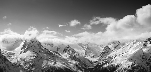 Image showing Black and white panorama of sunlight mountains in cloud