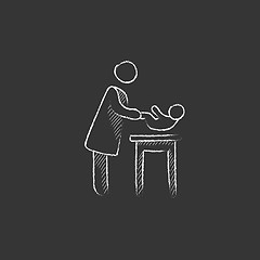 Image showing Mother taking care of baby. Drawn in chalk icon.