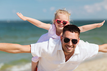 Image showing happy family having fun on summer beach