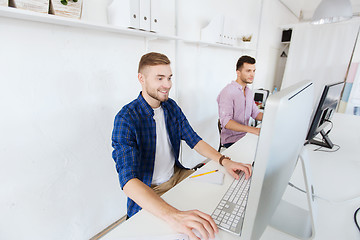 Image showing creative man or student with computer at office