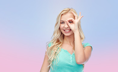 Image showing young woman making ok hand gesture