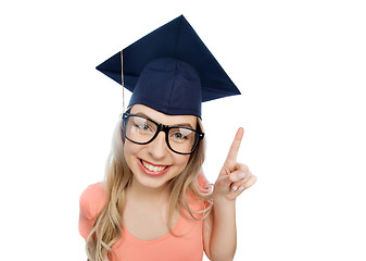 Image showing smiling young student woman in mortarboard