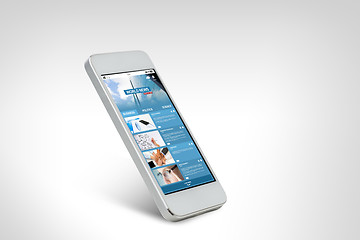 Image showing smarthphone with world news web page on screen