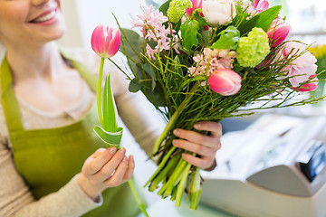 Image showing close up of woman making bunch at flower shop