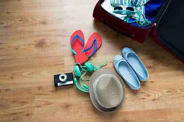 Image showing close up of travel bag with clothes and stuff