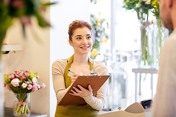 Image showing florist woman and man making order at flower shop