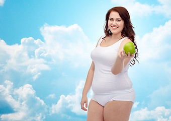 Image showing happy plus size woman in underwear with apple