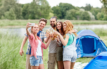 Image showing happy friends taking selfie by smartphone at camp