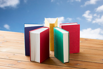 Image showing close up of books on wooden table