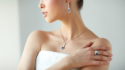 Image showing beautiful woman with earring, ring and pendant