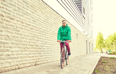 Image showing young hipster man riding fixed gear bike
