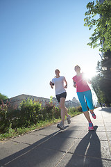 Image showing female friends jogging