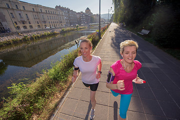 Image showing female friends jogging