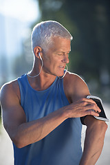 Image showing portrait of handsome senior jogging man