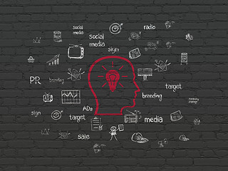 Image showing Advertising concept: Head With Lightbulb on wall background