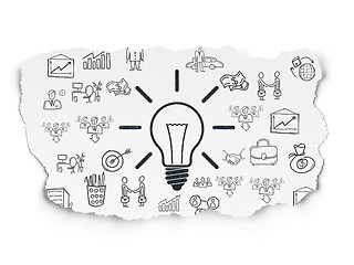 Image showing Business concept: Light Bulb on Torn Paper background