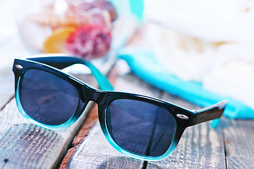 Image showing sun glasses and flip flops 