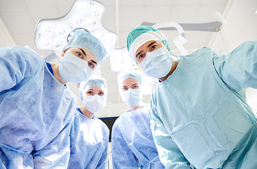 Image showing group of surgeons in operating room at hospital