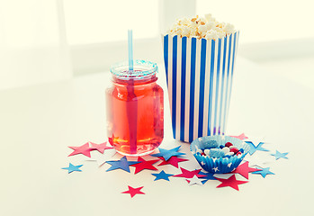 Image showing drink and popcorn with candies on independence day