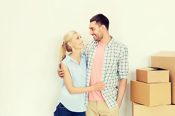 Image showing couple with cardboard boxes moving to new home