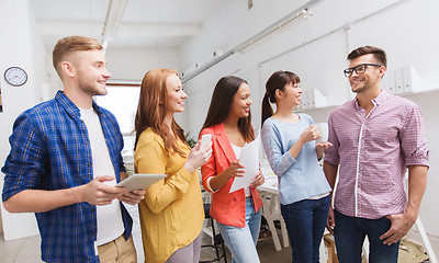 Image showing creative team on coffee break talking at office