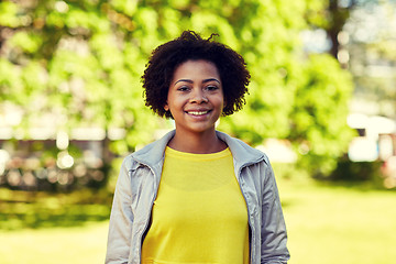 Image showing happy african american young woman in summer park