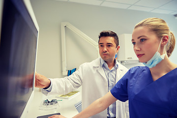 Image showing dentists with x-ray on monitor at dental clinic