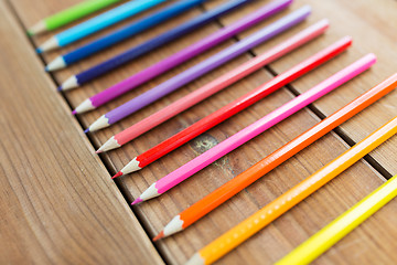 Image showing close up of crayons or color pencils on wood