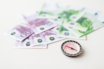 Image showing close up of compass and euro money on table