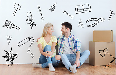 Image showing couple with cardboard boxes moving to new home