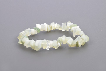 Image showing Splintered jade chain on gray background