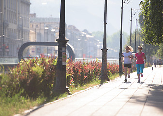 Image showing female friends jogging