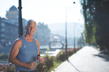 Image showing portrait of handsome senior jogging man