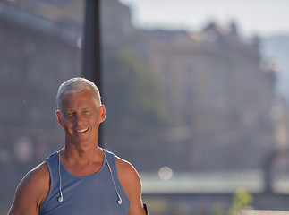 Image showing portrait of handsome senior jogging man