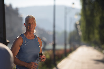 Image showing portrait of handsome senior jogging man