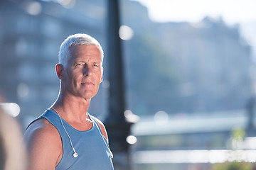 Image showing portrait of handsome senior jogging man