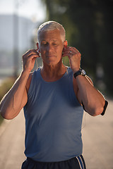 Image showing portrait of handsome senior jogging man