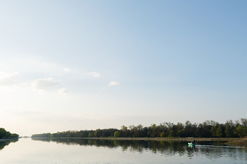 Image showing man sails on a boat