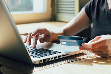 Image showing the girl is shopping on the Internet