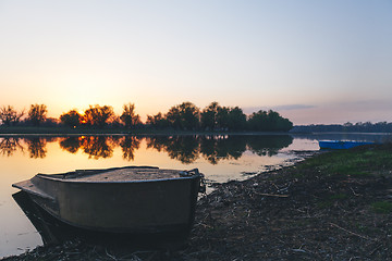 Image showing boat moored to the banks of the river