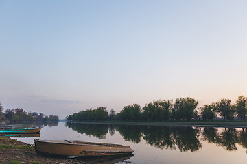 Image showing boats moored to the banks of the river