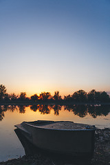 Image showing boat moored to the banks of the river