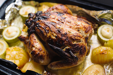 Image showing fried chicken on the baking sheet with vegetables