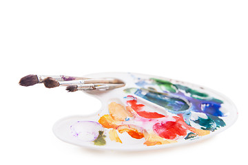 Image showing Heavy used artist\'s palette with brushes 