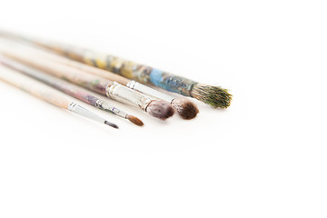 Image showing Dirty used paintbrushes 
