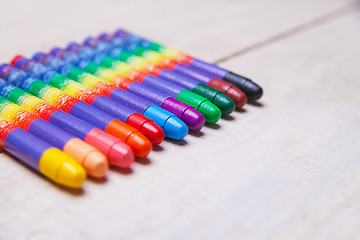 Image showing wax crayons on wood table