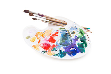 Image showing Heavy used artist\'s palette with brushes 