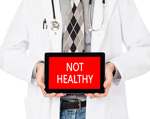 Image showing Doctor holding tablet - Not healthy